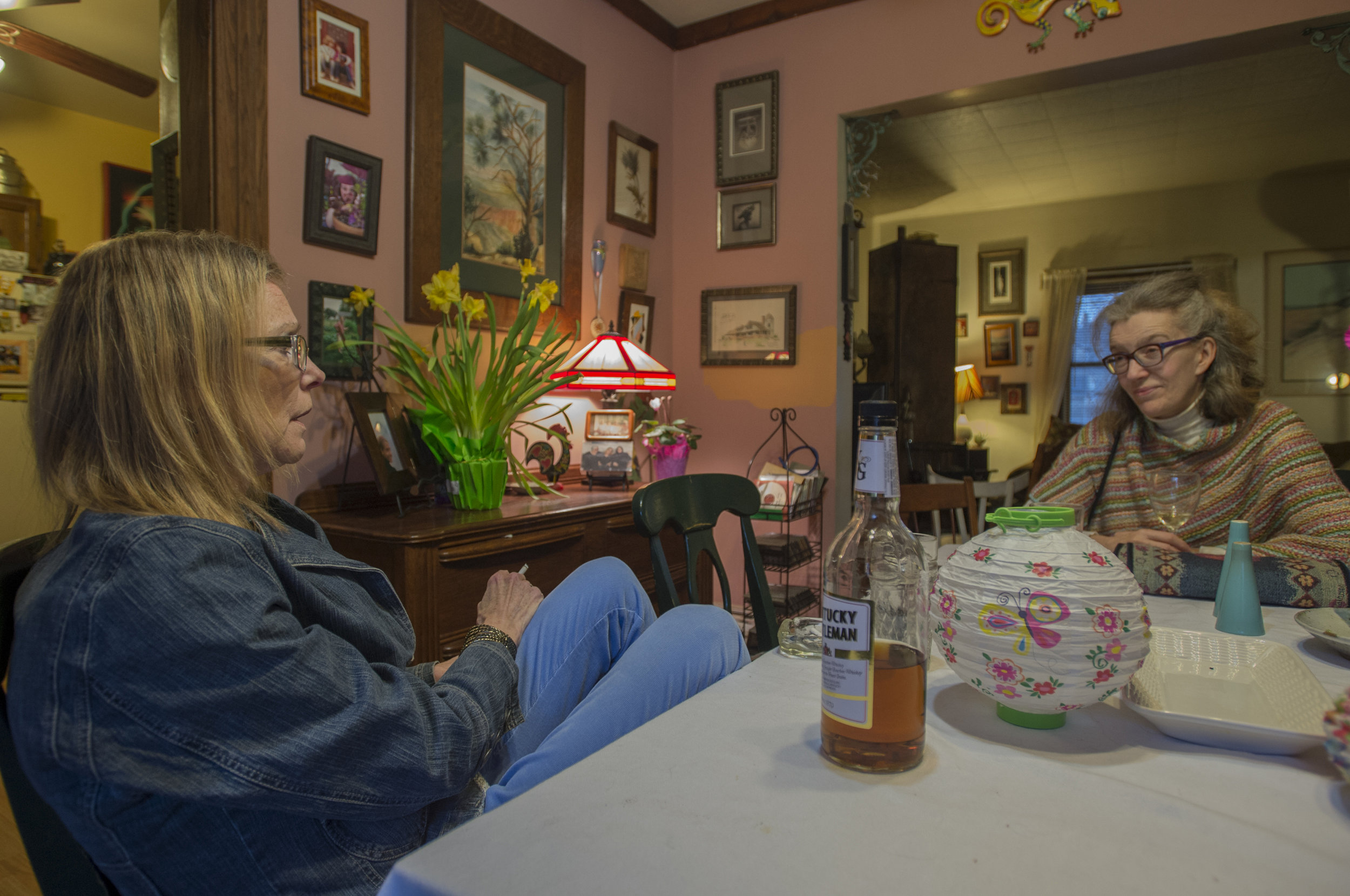  Carol talks with her friend Sue Engel following an Easter dinner shared with friends and family. 