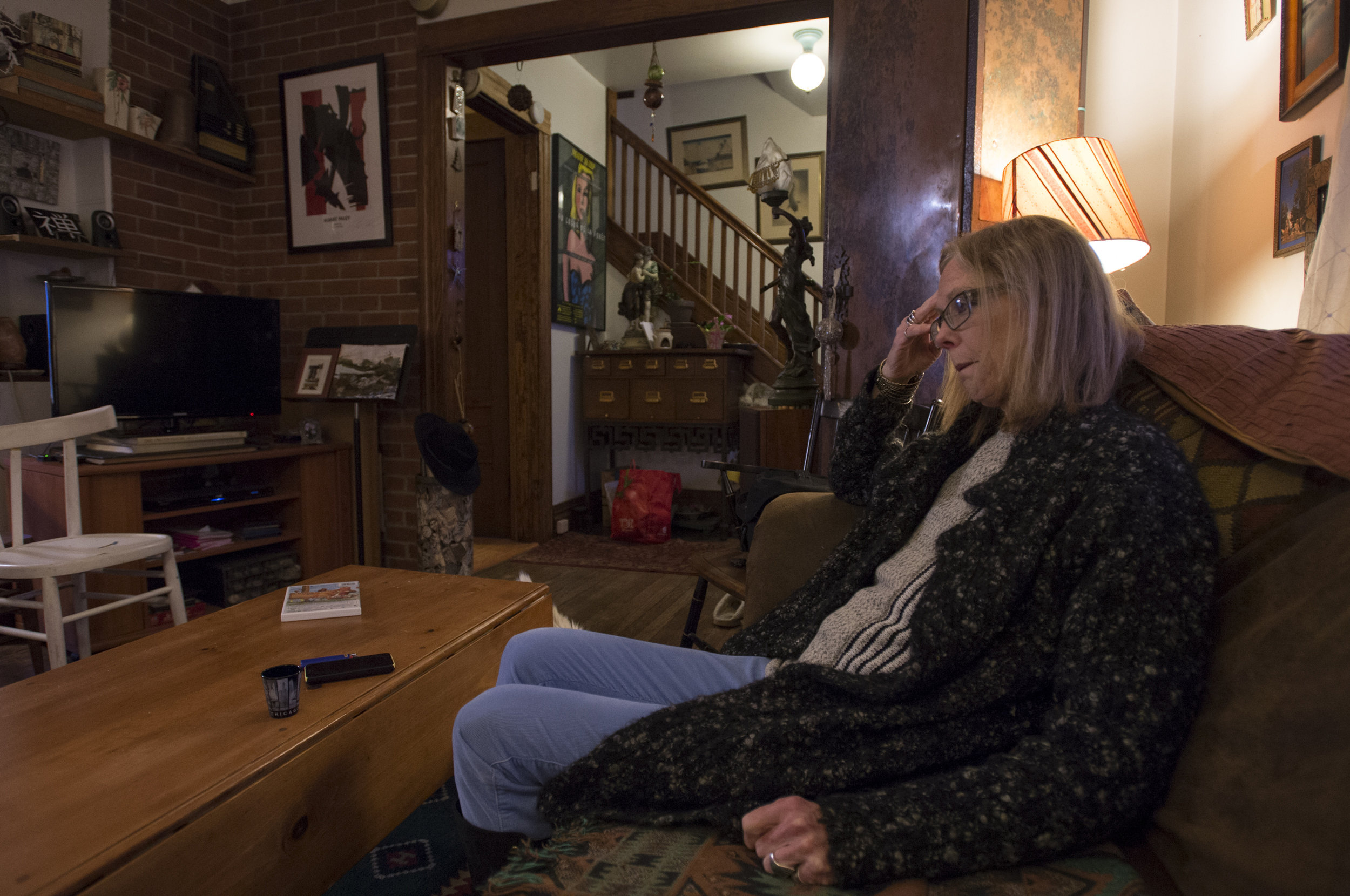  Carol rests on her couch following a long, busy Easter Sunday filled with emotional goodbyes. 