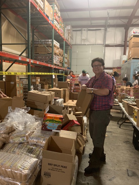 Bob Gobbo, MD at the Cherry Harvest Migrant Farmworker Food Drive packing event, Wednesday, June 12.