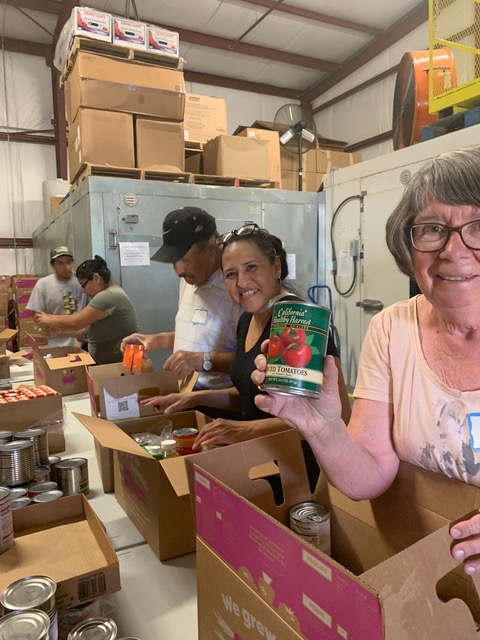 Packing boxes for migrant farmworker food drive (right to left): Carol Hayes, Carmen Barrera, Joel Pelayo, Liliana Lachino, and Mariano Sendejas