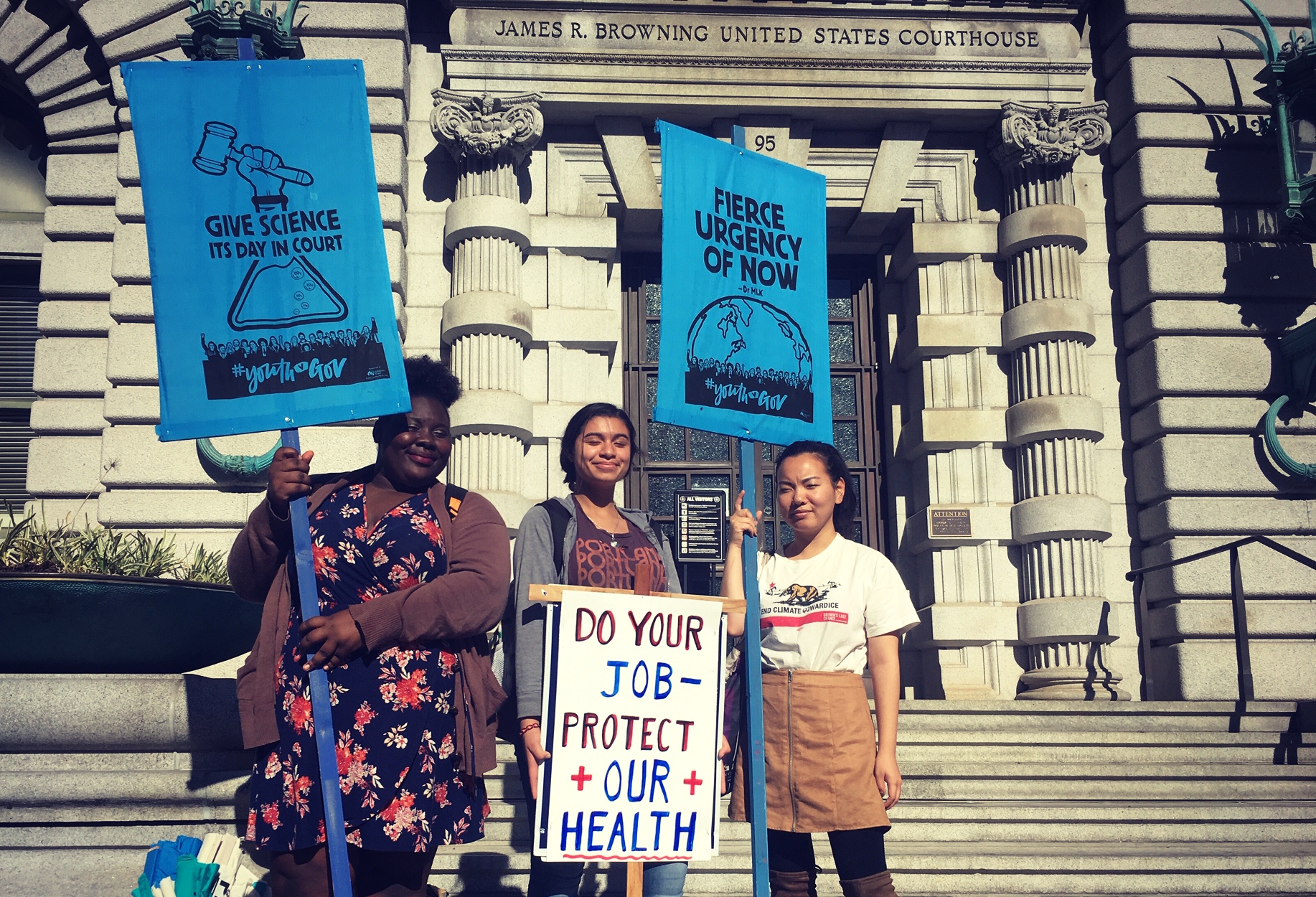Linda Scruggs (left) stands alongside participants at the San Francisco rally to support the climate kids.