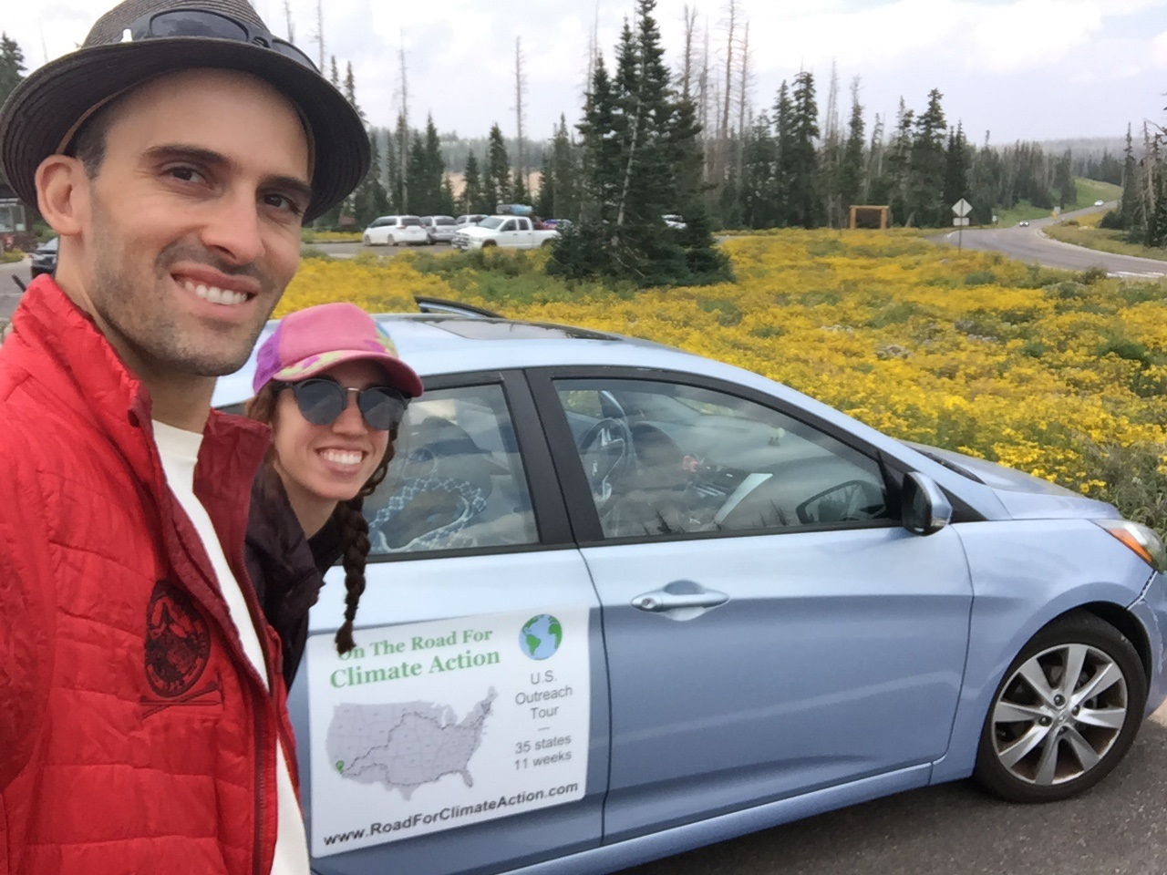Shahir Masri and his fiancée, Athina, with the car they took “On The Road For Climate Action.”