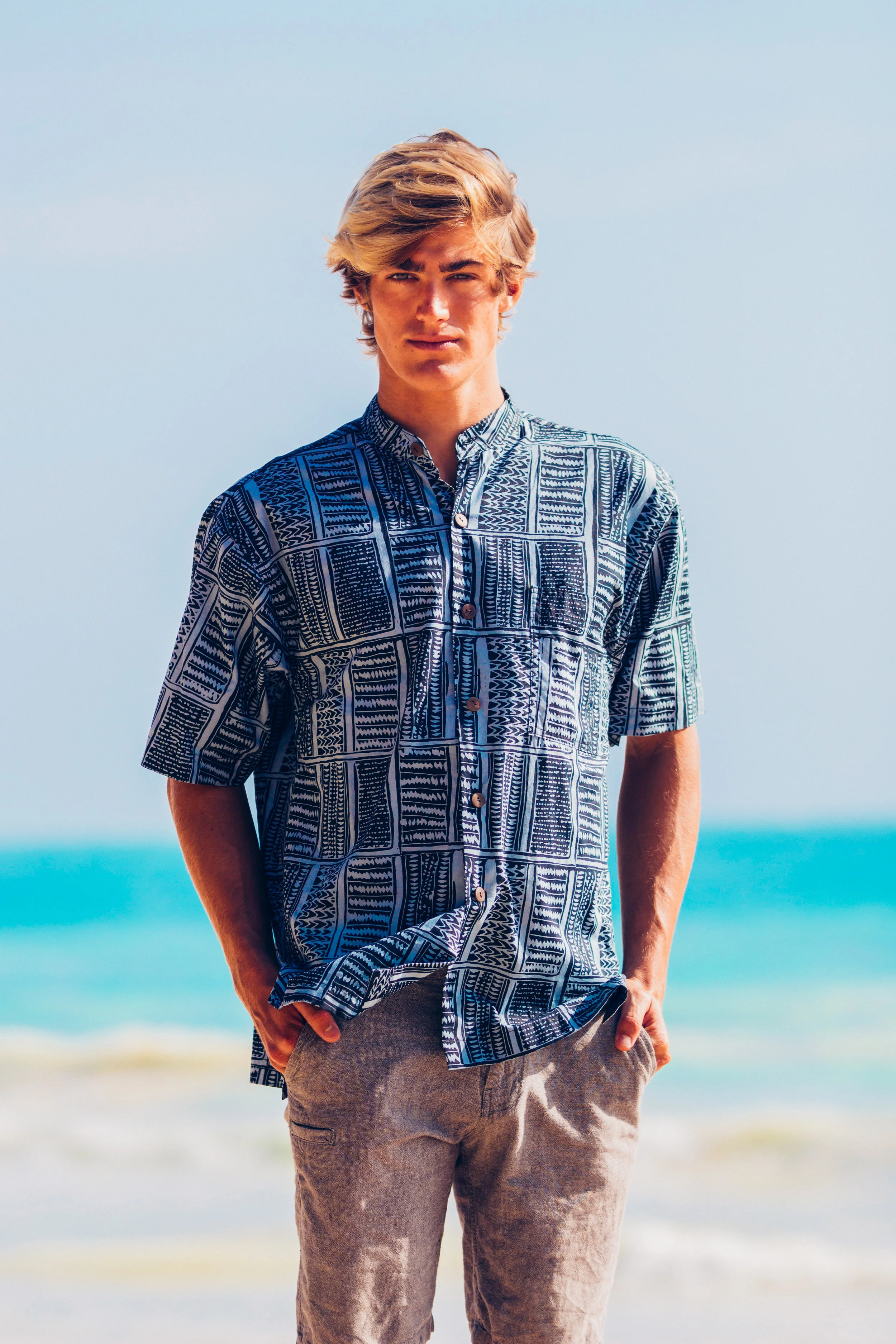 The Rio Shirt is a full cut shirt made of 100% Cotton and has a mandarin (band) collar. Available in long sleeve and short sleeve, this shirt is perfect for casual or dressy occasions. Matched with the uniqueness of our prints, this shirt is one of a kind. Our shirts are cut big so we highly recommend you order one size smaller than what you usually wear. For example, if you are a Medium you will definitely want to order a Small. $86.00