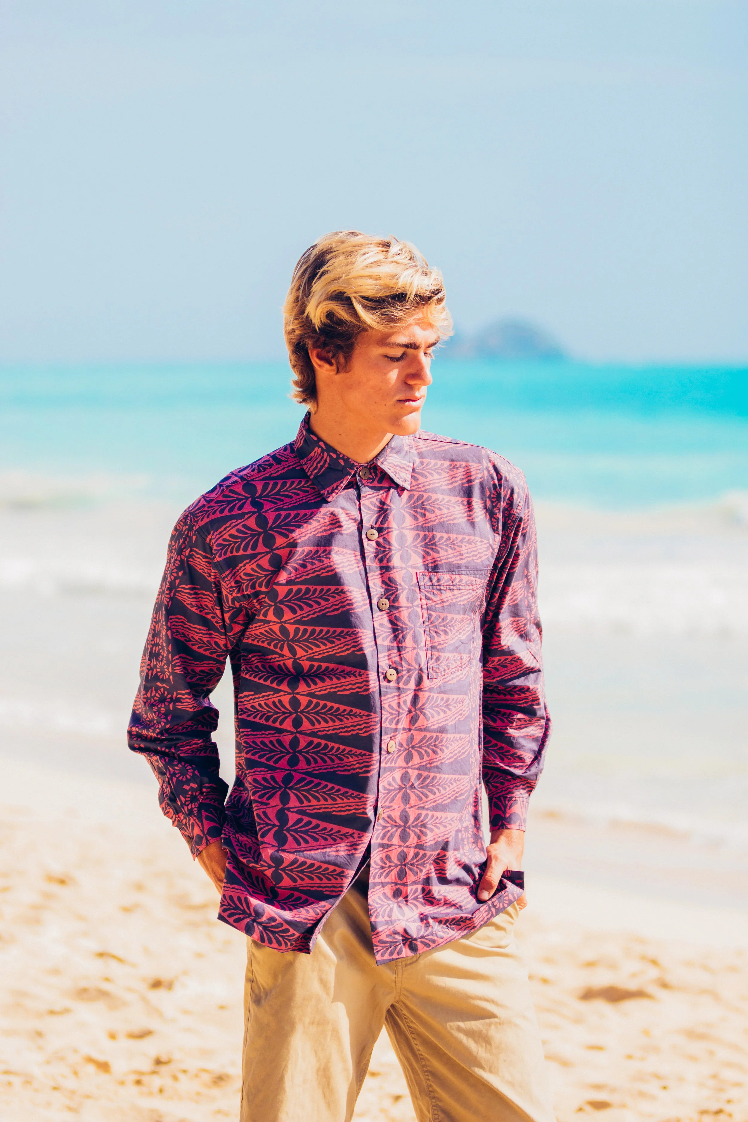 This is our Aloha style shirt. Made of 100% Cotton with a standard collar, coconut buttons and one pocket. Cut long, with side slit seams for comfort and flattering fit. Our shirts are cut big so we highly recommend you order one size smaller than what you would normally wear! For example, if you are a Small you will definitely want to order XS from us! $110.00