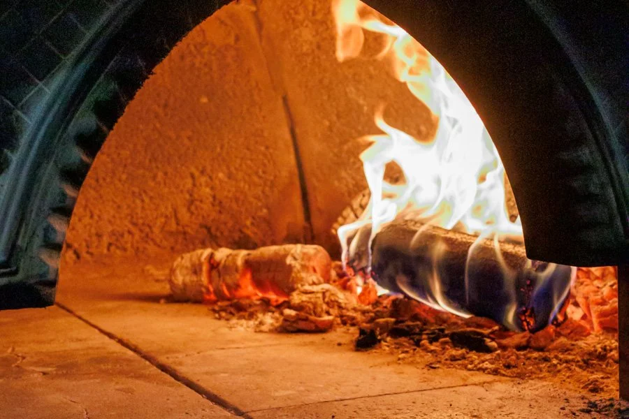 wood burning in woodfired pizza oven brisbane.jpg