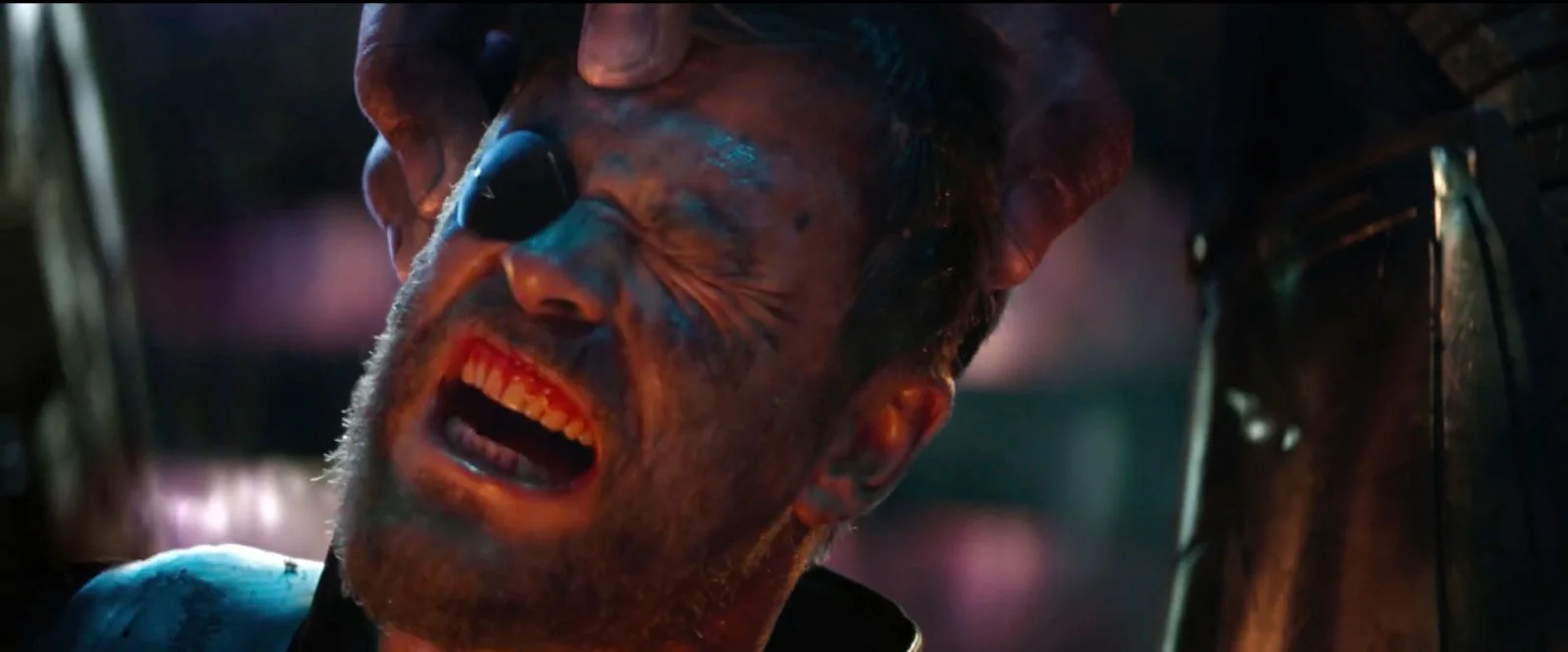  Thor's head being held by Thanos