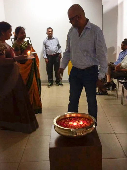 Arvind Chenji floating a candle.