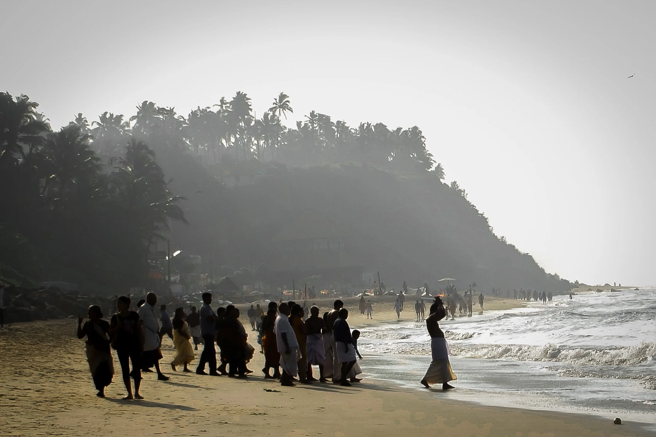 Varkala Beach | Kerela. The ashes of the deceased are carried into the ocean by a male relative, followed by other grieving friends and family members. This will take place as part of the Hindu cremation ceremony. 