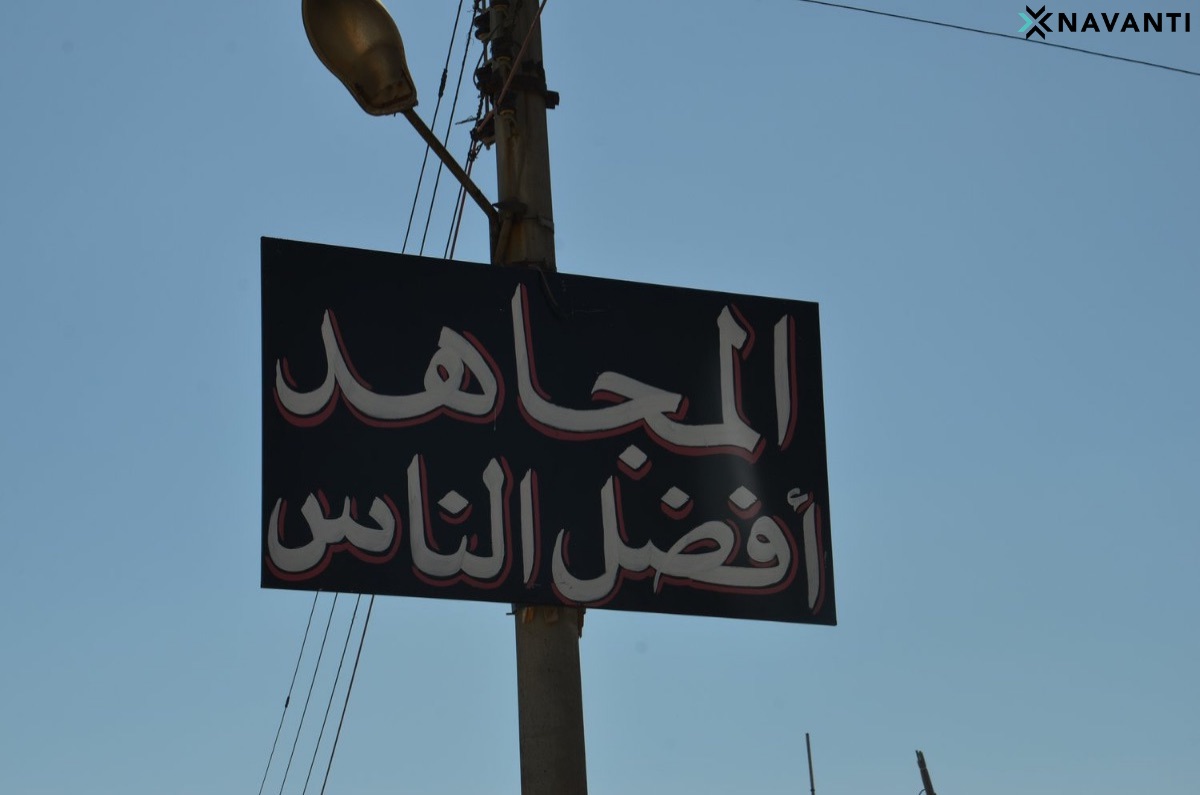 A sign in Idlib reads, “The Holy Warrior is the Best Sort of Person.” Source: Navanti