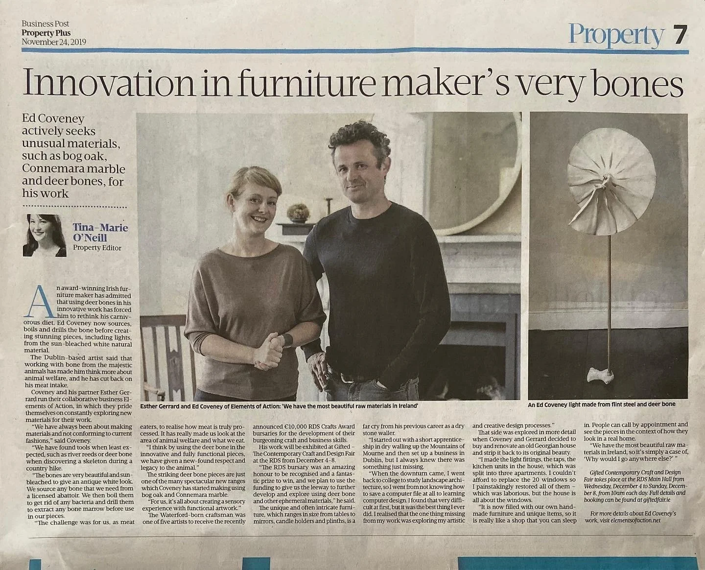 Newspaper article titled "Innovation in furniture maker's very bones" featuring a photo of Ed Coveney and a woman, standing in a room with a fireplace. Also includes an image of a light made from flint steel and deer bone.