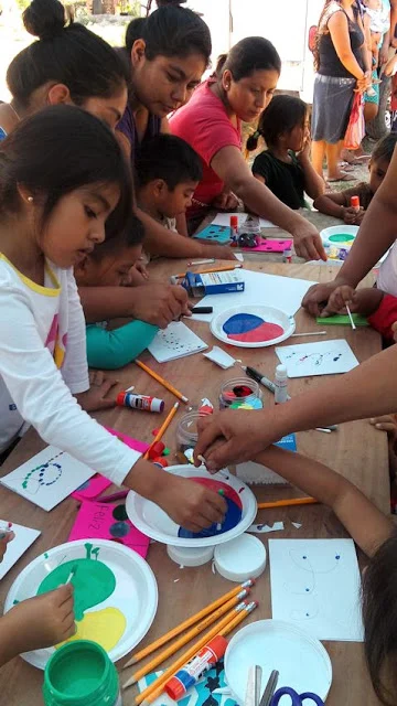 Making Christmas cards with the mothers and little children.