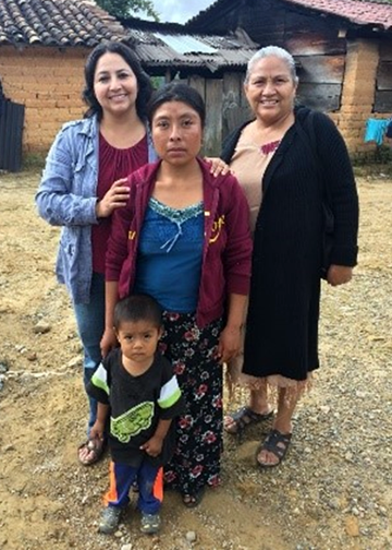 Maria Villa Pablo (left) with a family in Oaxaca