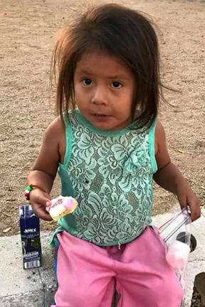 oaxaca_girl eating snacks.png