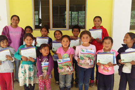 oaxaca_children with certificates_tere in the mountains.png