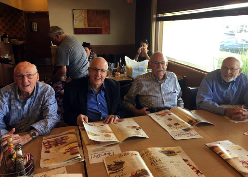 group of men at breakfast.png