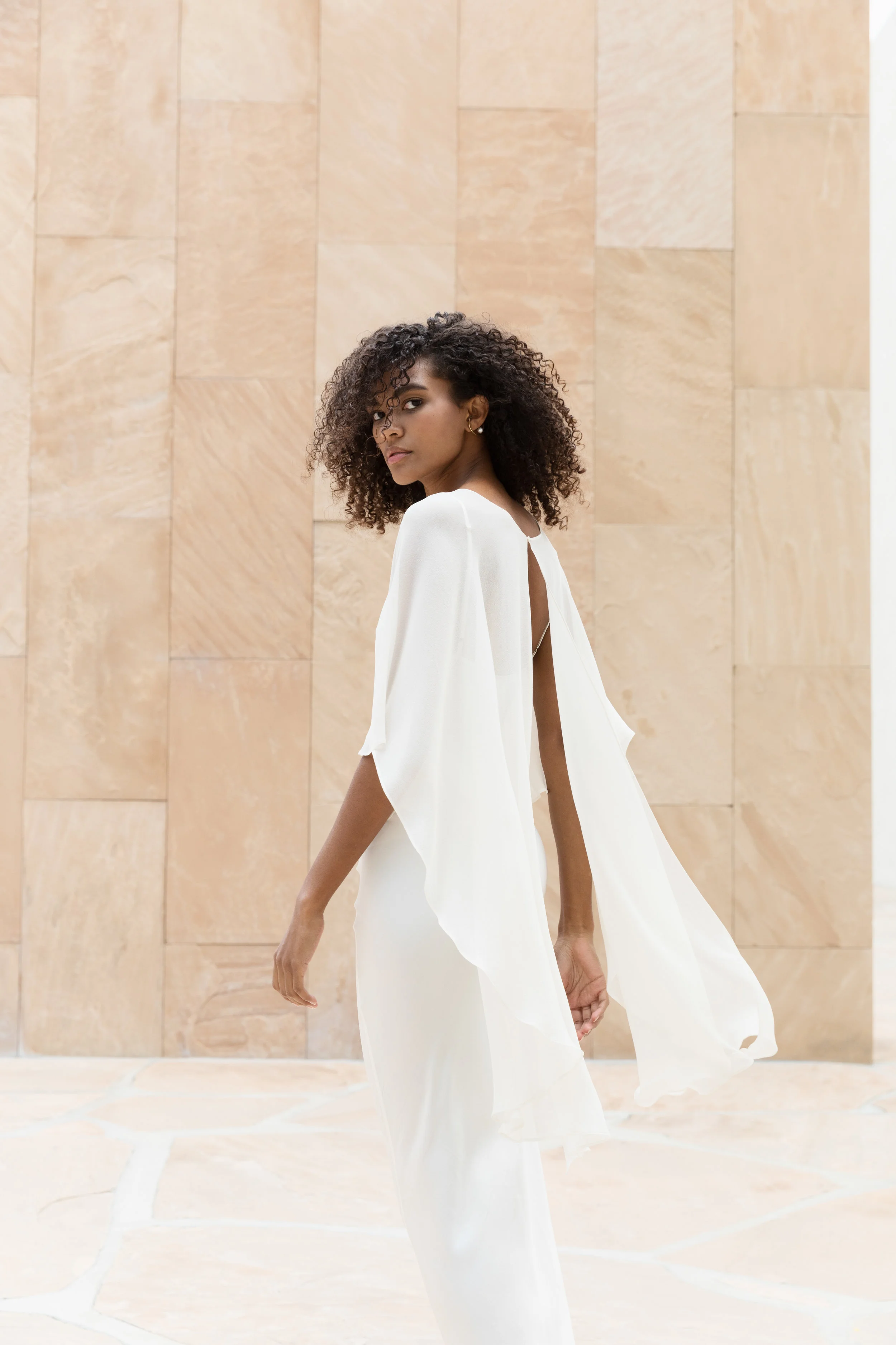 VANESSA OUMA in a bias cut Seam Front Slip and Short Cape Shawl