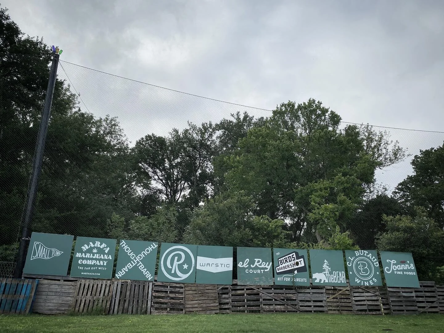 Way out in left field. Seems appropriate. And in good company as well. Thanks for the signage, Jack. And another great peace of art from Brett.