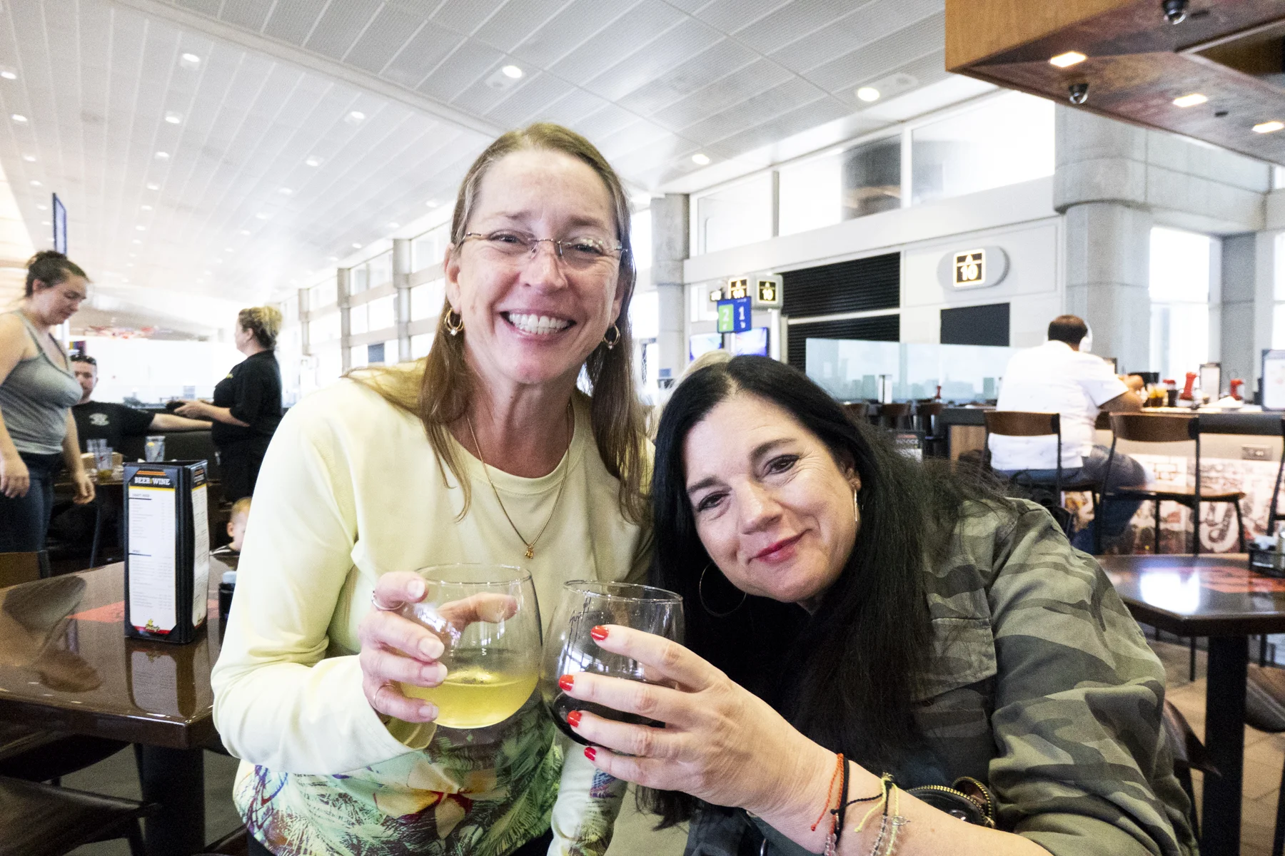 featured: Mindy (left), Karen (right) at the Tampa International Airport