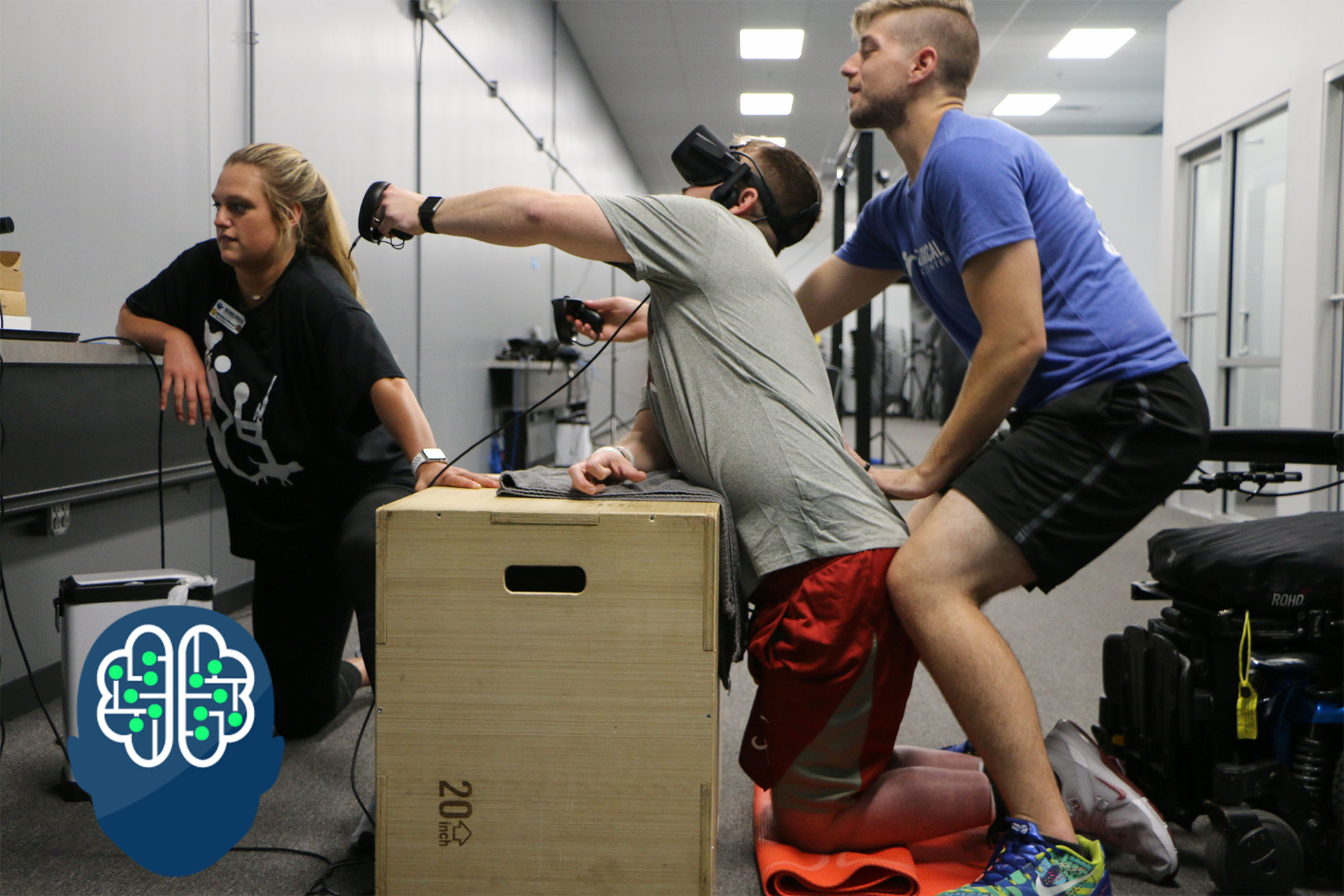 Traumatic Brain Injury patient in a modified tall kneeling position to work on glute strength, coordination, and functional reaching customized for affected left side