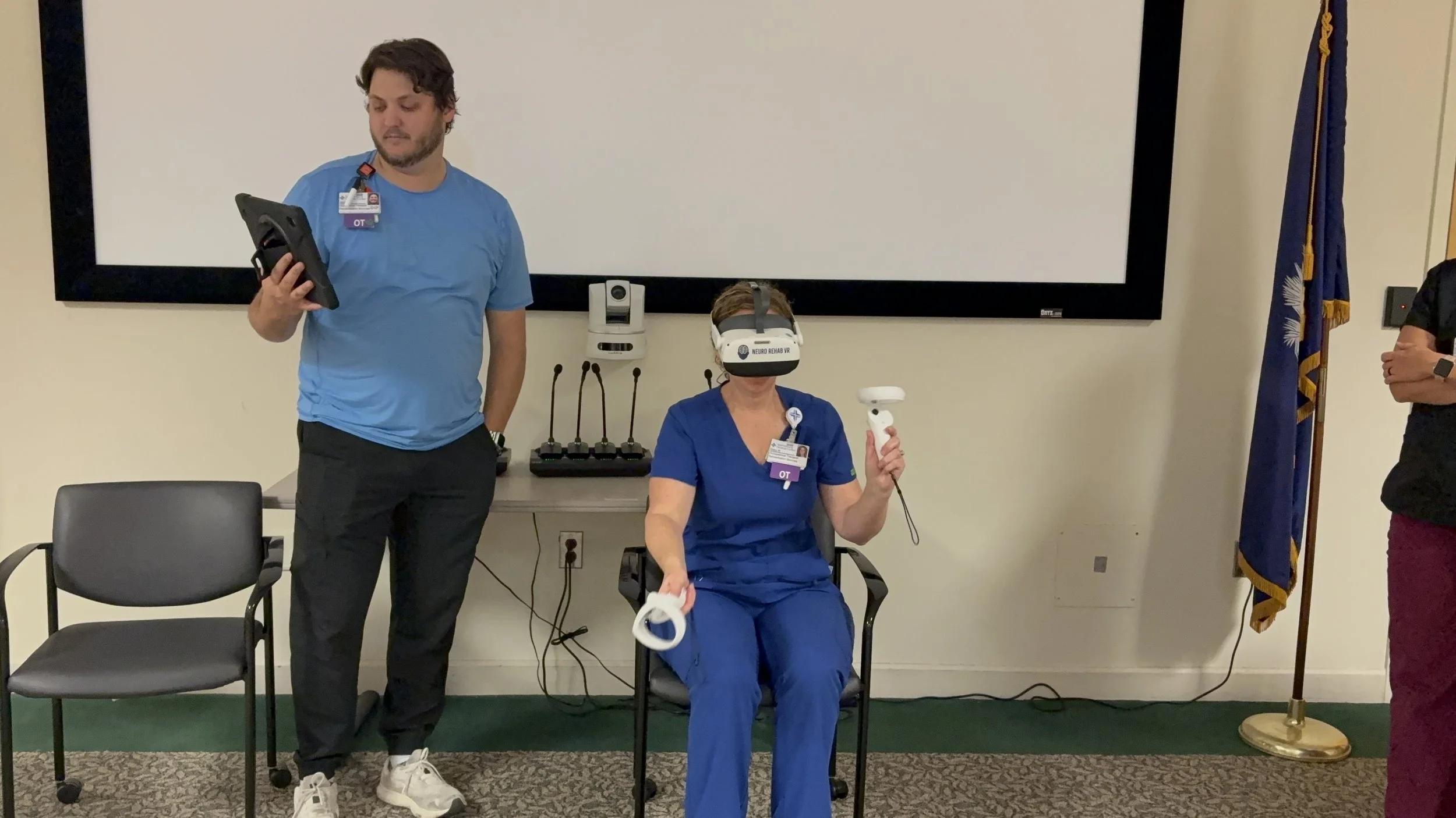 Physical Therapist monitoring Patient