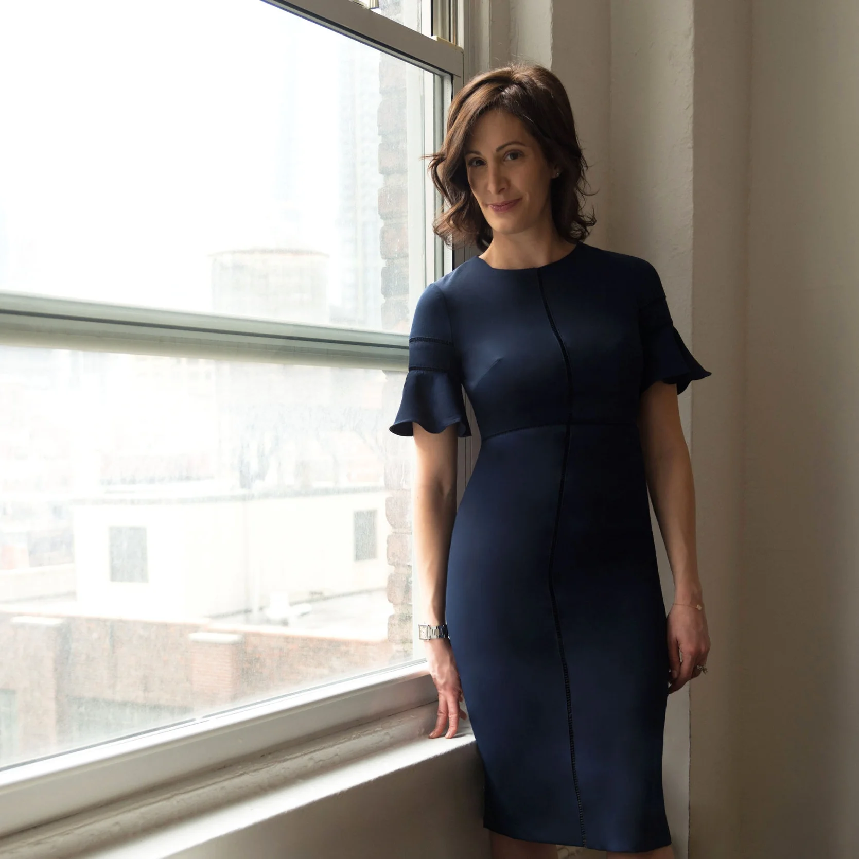 Jena is wearing our Jena Midi ($138)