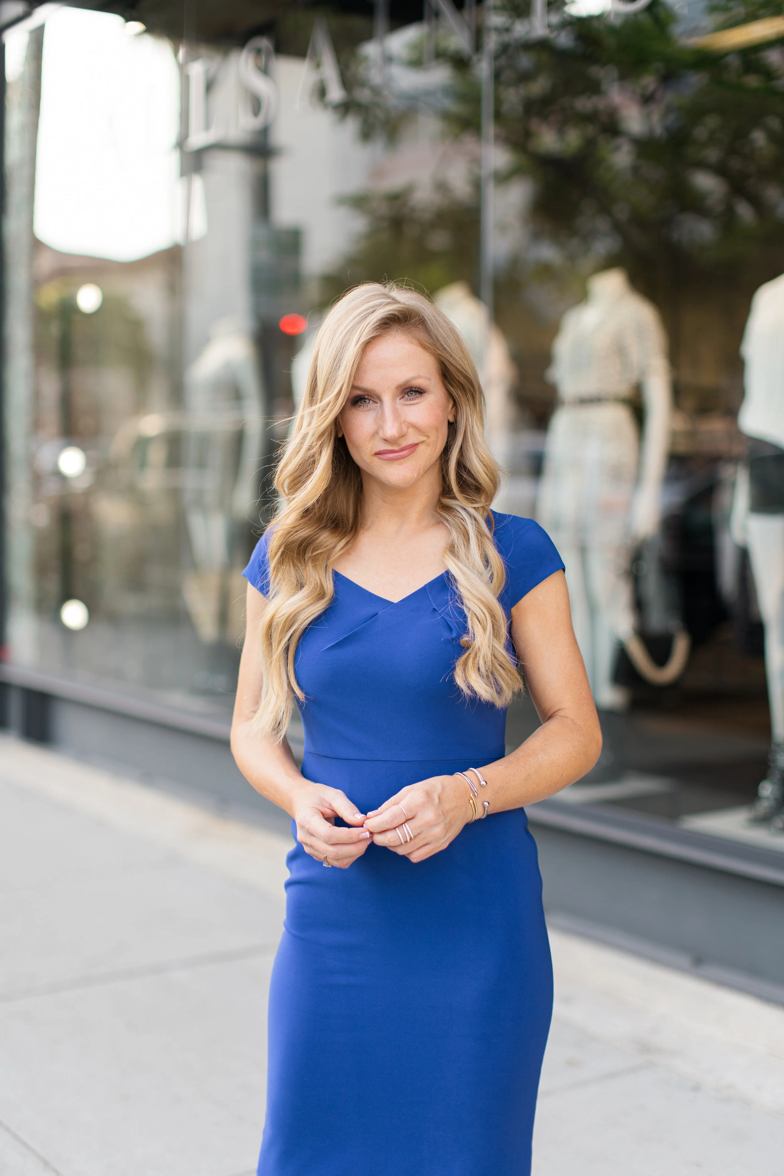 Meredith is wearing our Linette Midi , also available in petite sizes.