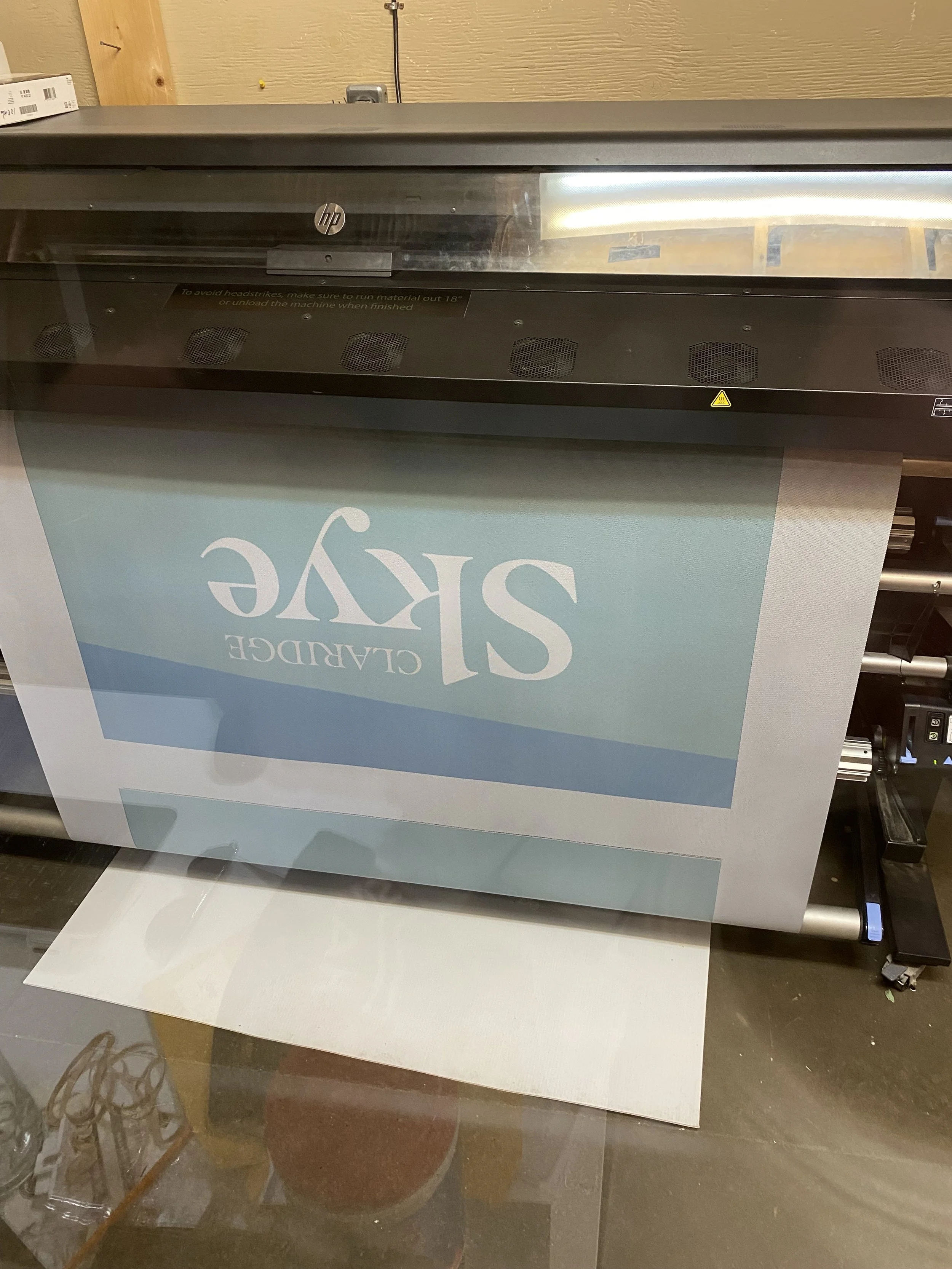 State-of-the-art HP large-format printer producing high-fidelity custom graphics for the Claridge Skye development inside our Ottawa fabrication studio.