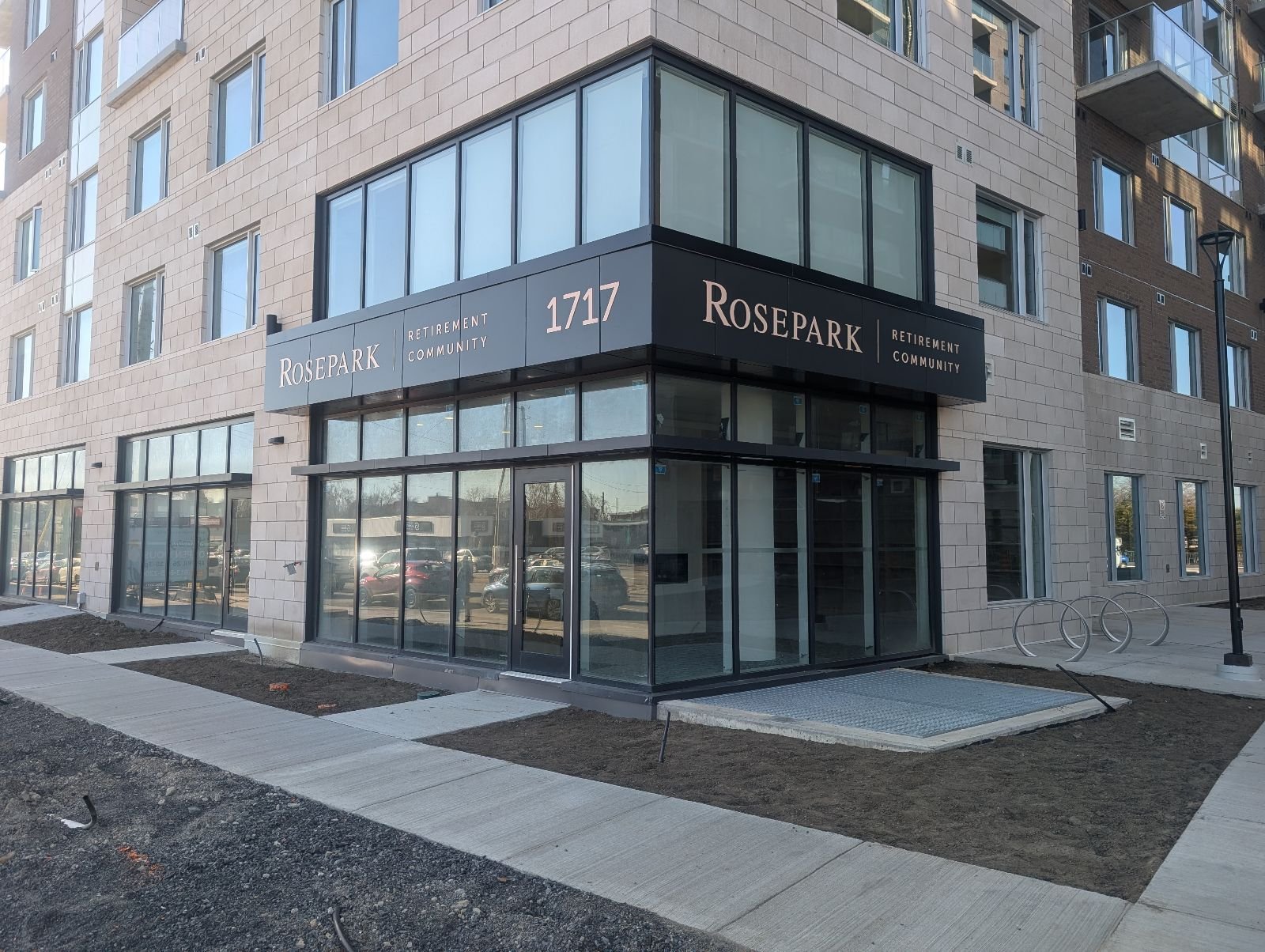 Premium custom dimensional lettering mounted on a dark architectural fascia band, creating an elegant exterior building sign for the Rosepark Retirement Community in Ottawa West.