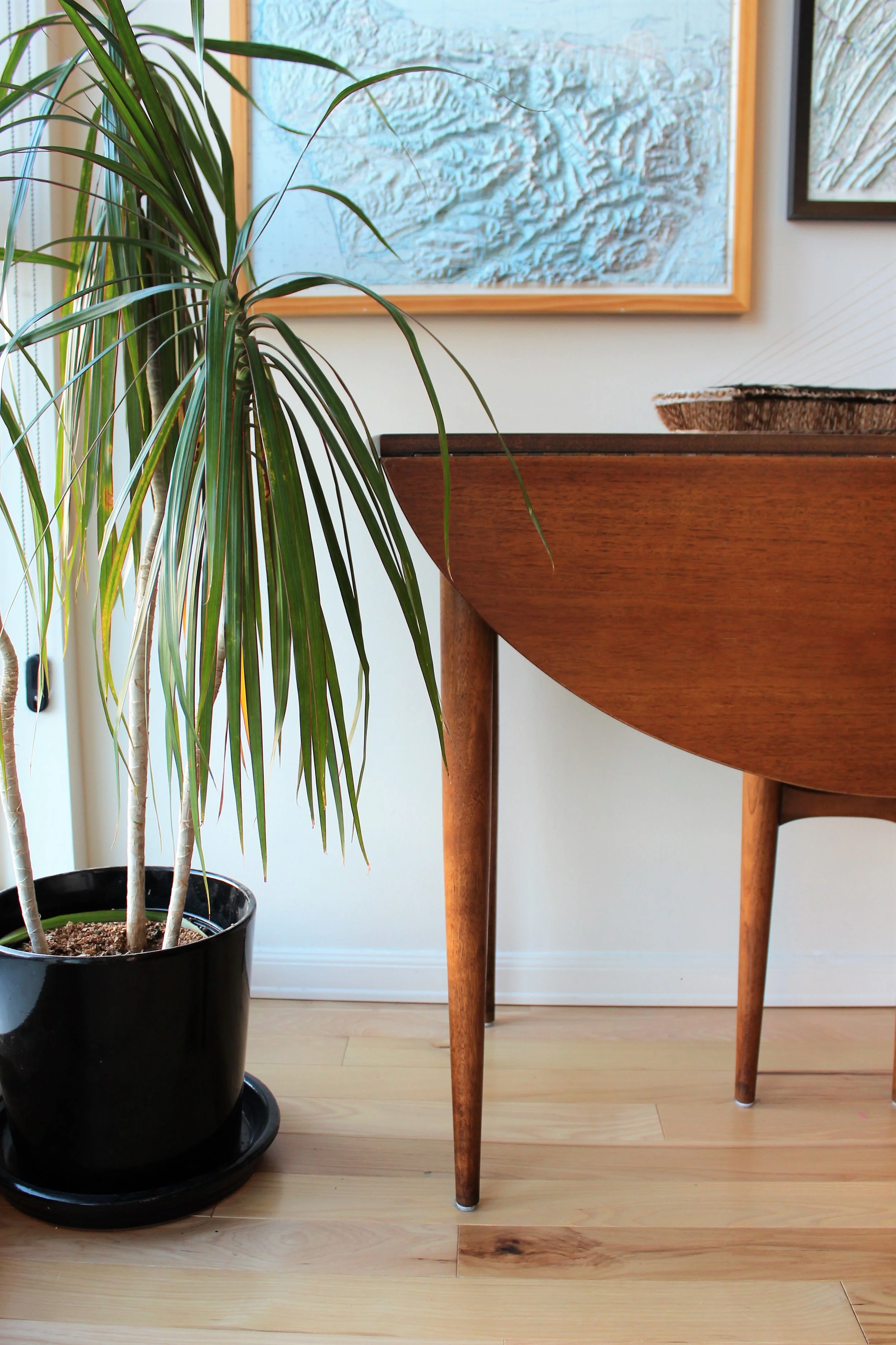 This is a great example of using what our clients already have and making it work. Luckily, this client had some beautiful pieces. This dining table looks great against a wall when not being used as a dining table when guests come to visit. 
