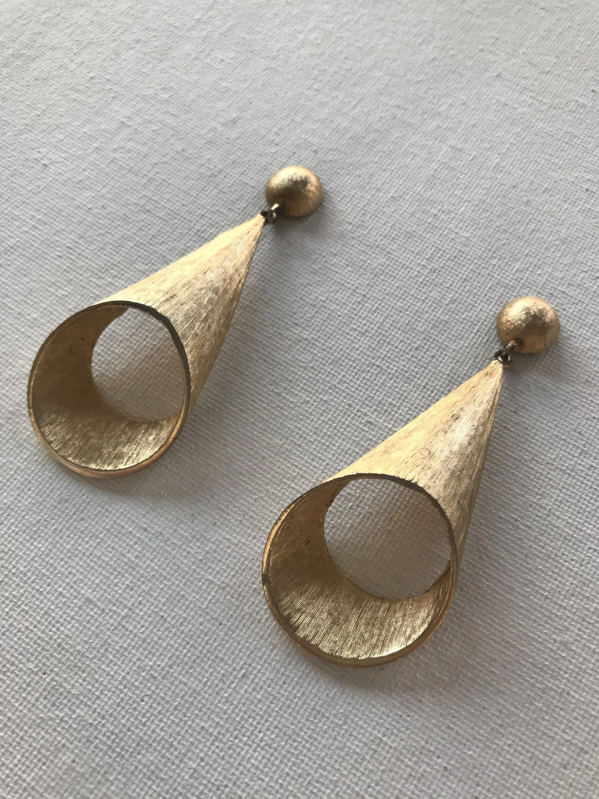 Detail View of Goldtone Brush Textured Cone Drop Earrings