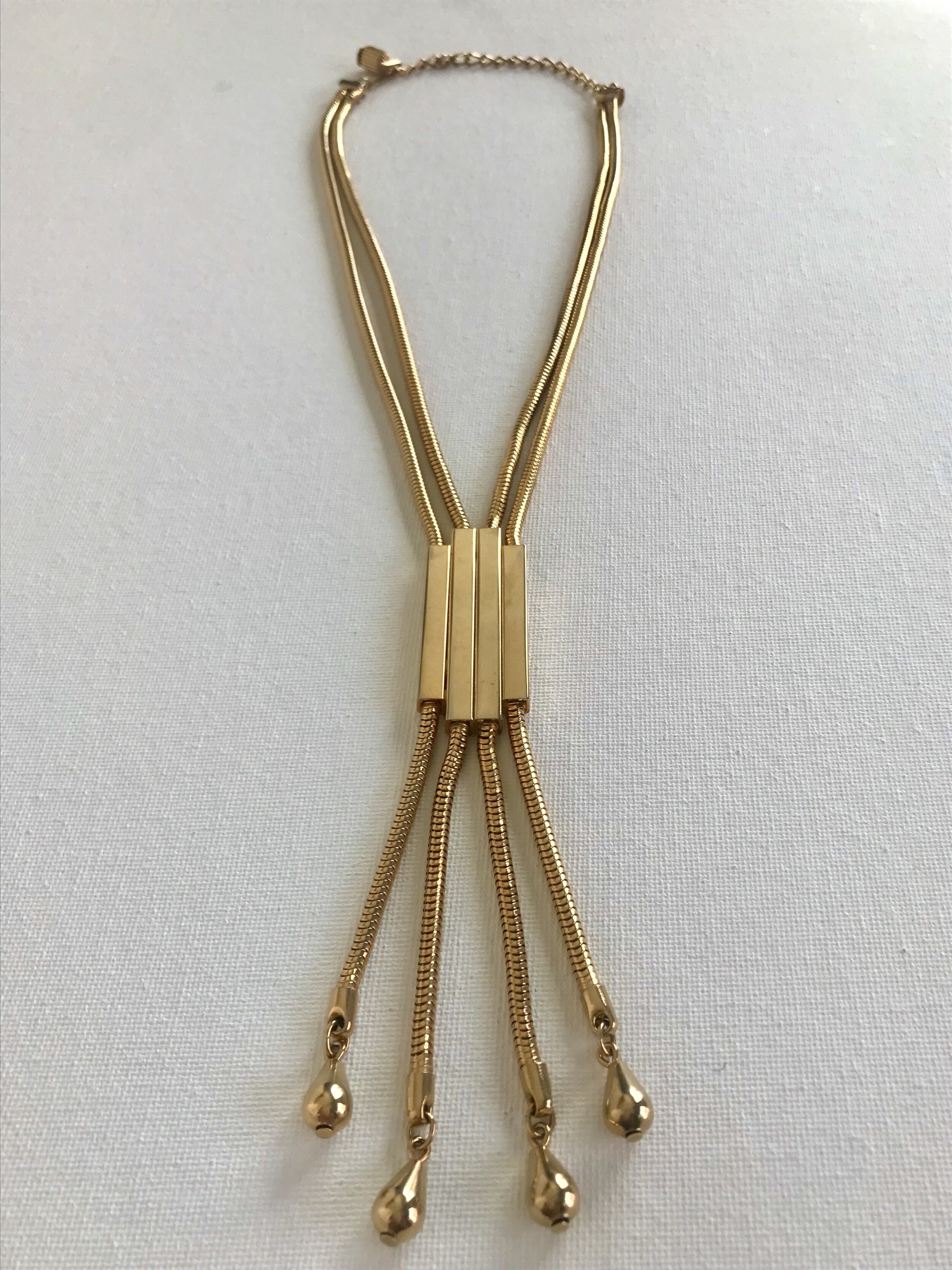 Front View of 1970's Goldtone Graduated Pipe and Fringe Pendant Necklace