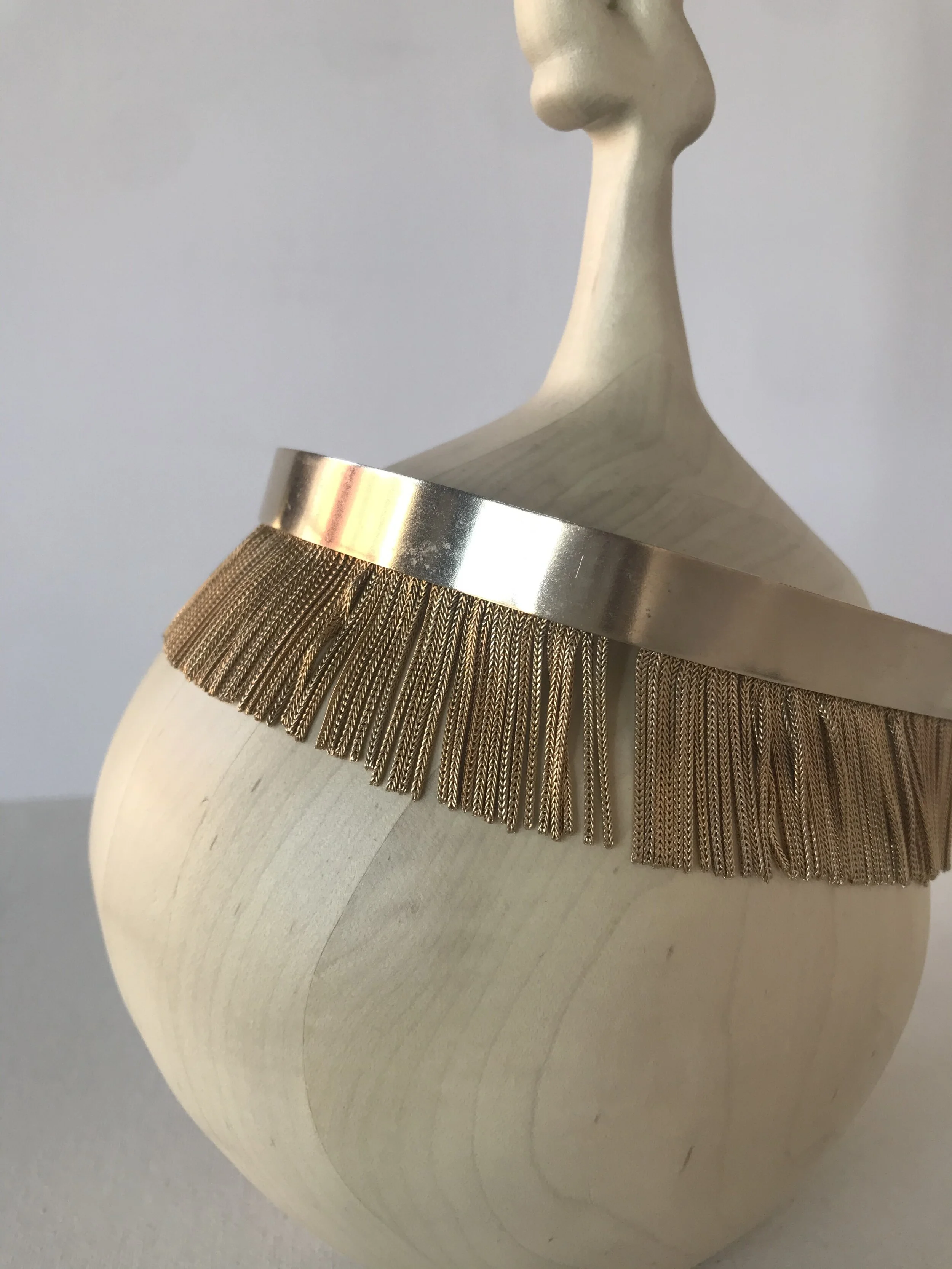 1960's Gold Fringe Headband on an Object