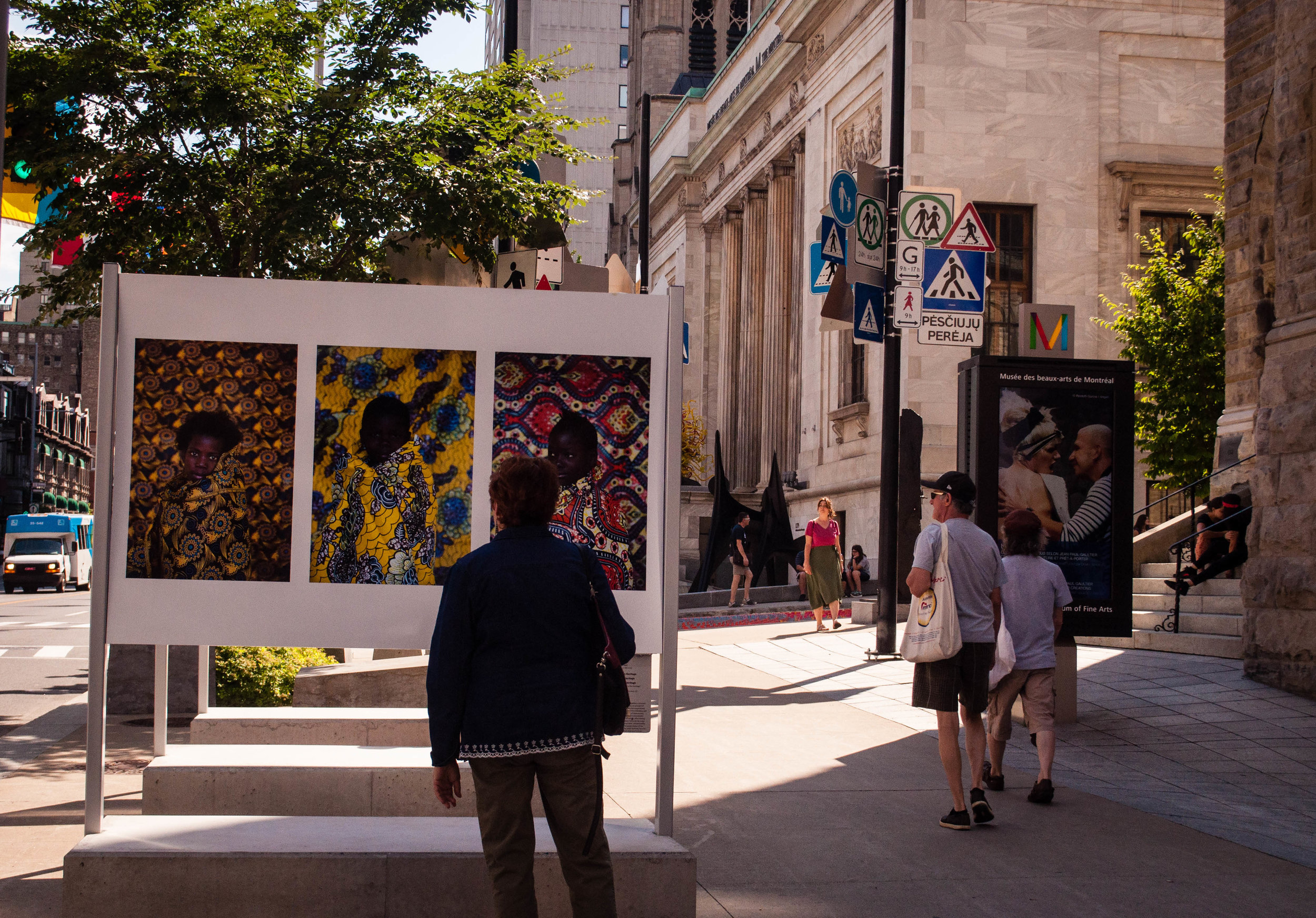 Women looking at a photograph in Sherbrook street in Montreal 