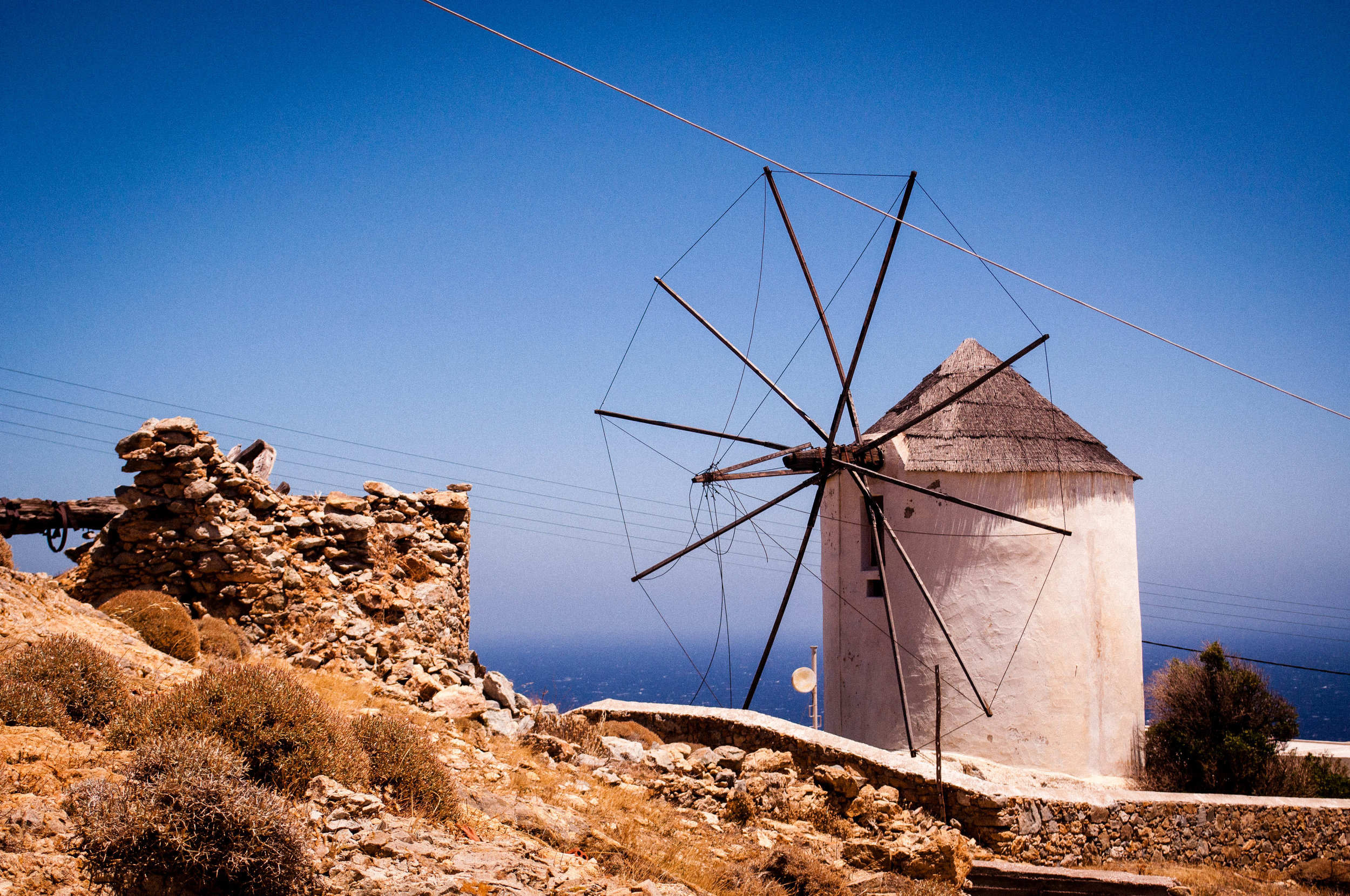White wind mill of Serifos with a blue sky on the backdrop
