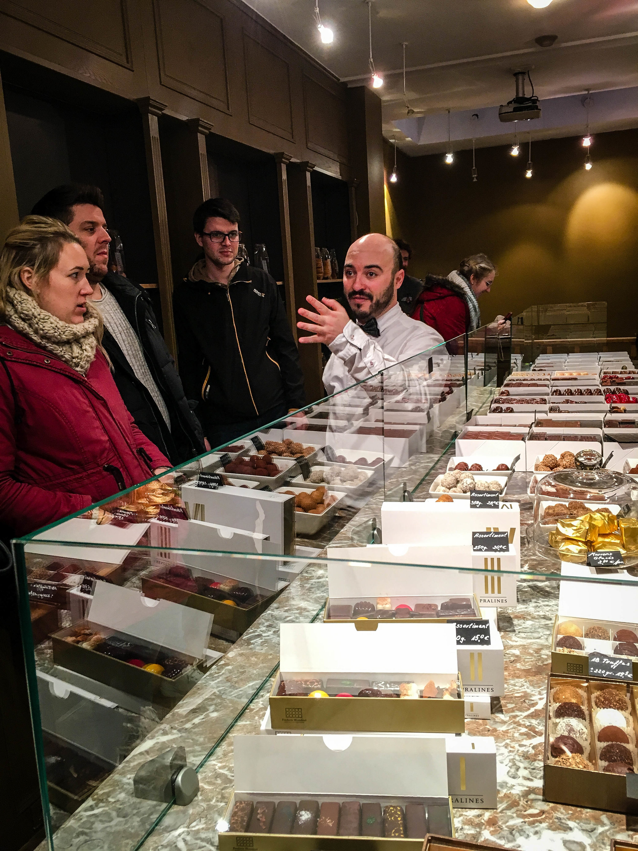 Explanation by the tour guide of the Brussels Journey in our Brussels Beer and Chocolate Tour