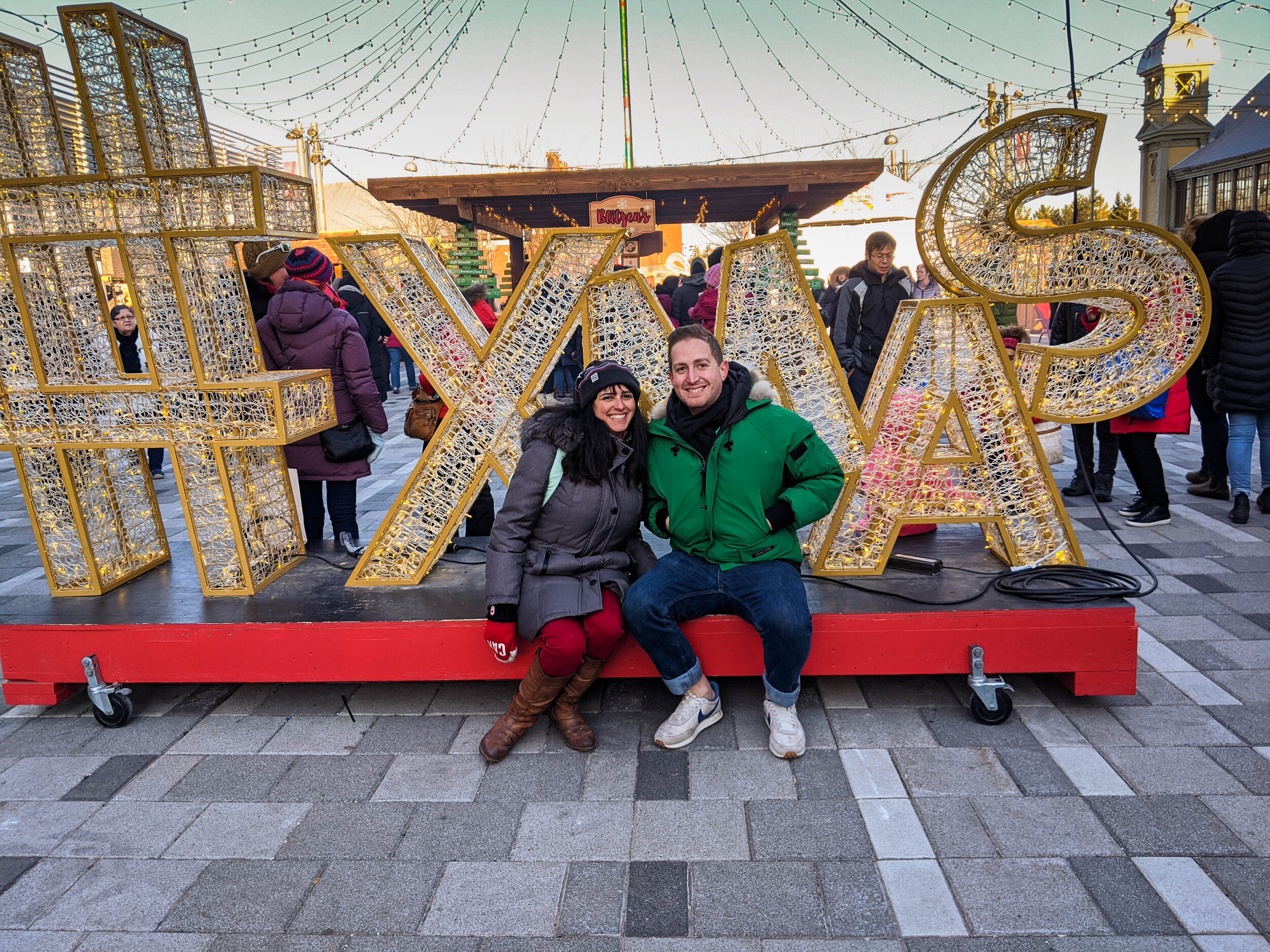 Couple at the Ottawa Christmas market sign