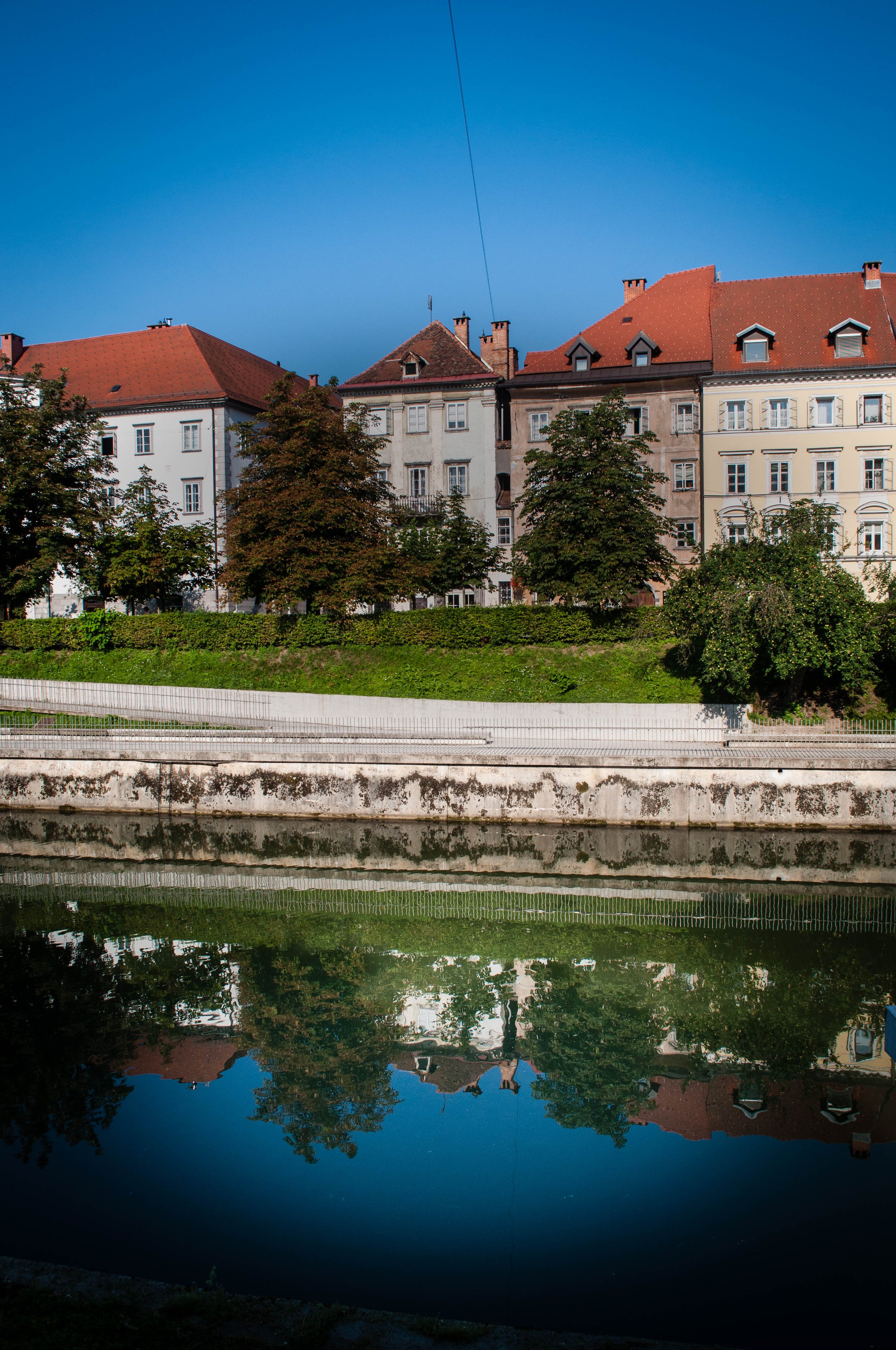 Walk along the River Ljubljanica Canal (Cankarjevo Nabrezje) as part of your Ljubjlana itinerary