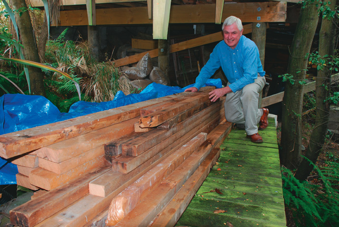 Recycled rimu stored flat, out of the weather