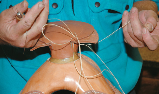 Pulling threads through on the horn