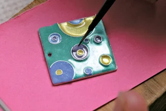 Apply colour. Images are built up over many firings which take only minutes