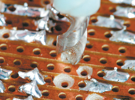 Cut copper strips with a twist drill