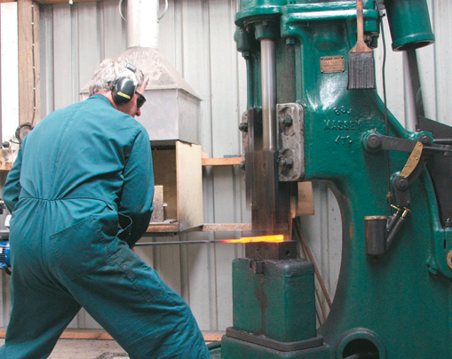 Steel under power hammer