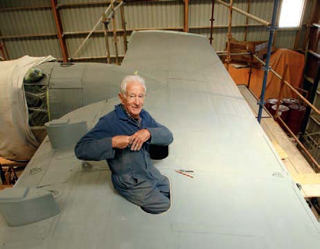 The smallest, chief engineer Mike Jackson, gets into the wing