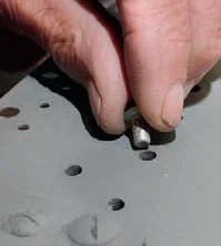 New parts are drilled to match the rivet holes in the wing