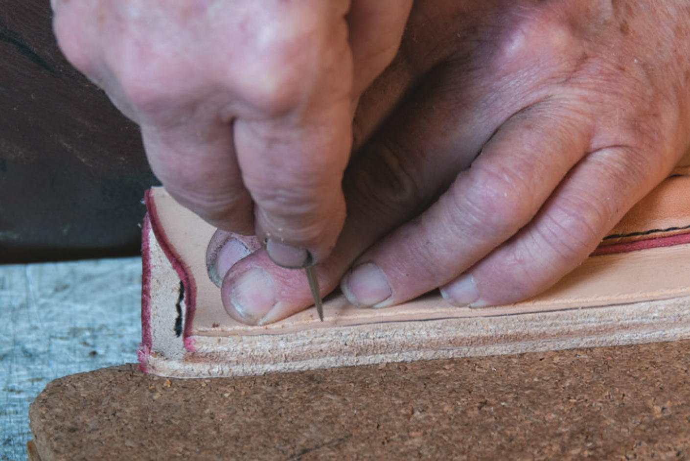 Stabbing stitch holes.