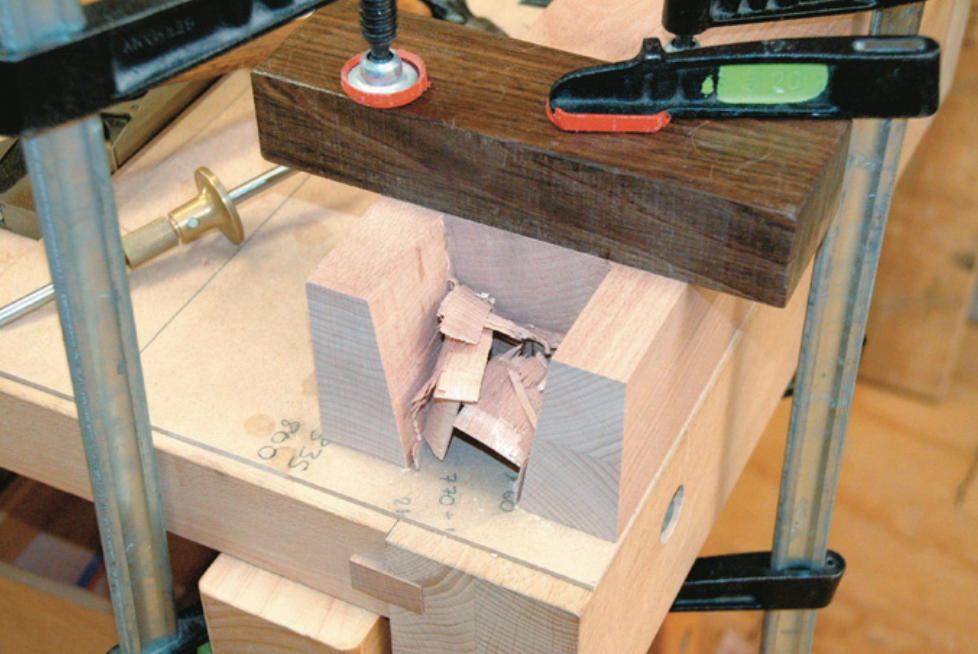 Cleaning out waste. Note pairing block to ensure squareness.