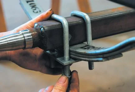 Locate axle and bolt onto springs.