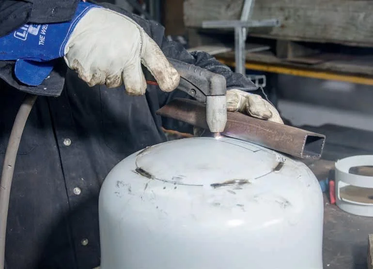 Using a straight edge to cut the rear opening.