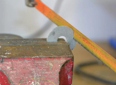 Flats on a washer will stop the T bolt turning