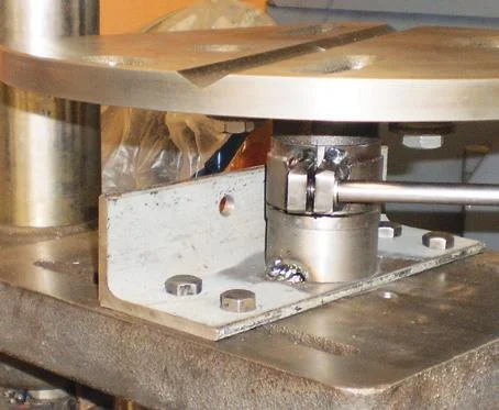 … on steel sleeve (split for clamping) welded to steel plate